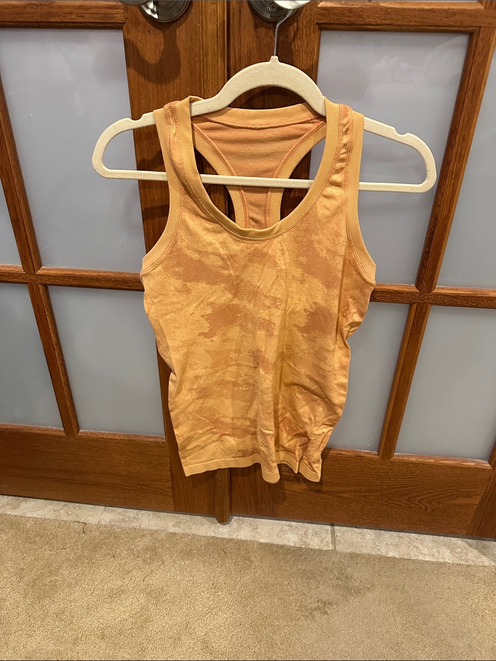 Women’s Sleeveless Athletic Tank Top — Orange Tie-Dye